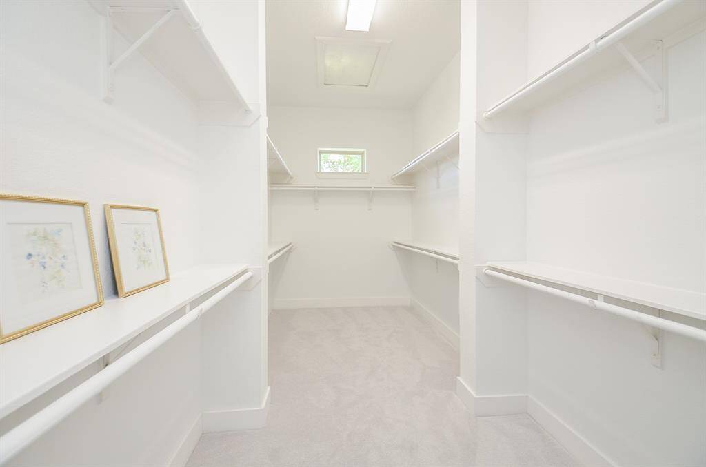 Large Primary Closet with Built-In Shelving