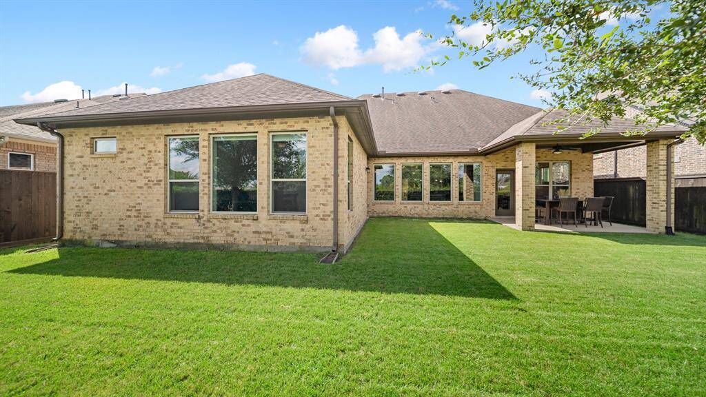 Home has Brick on All Four Sides, Sprinkler Front and Back with Full Gutters.