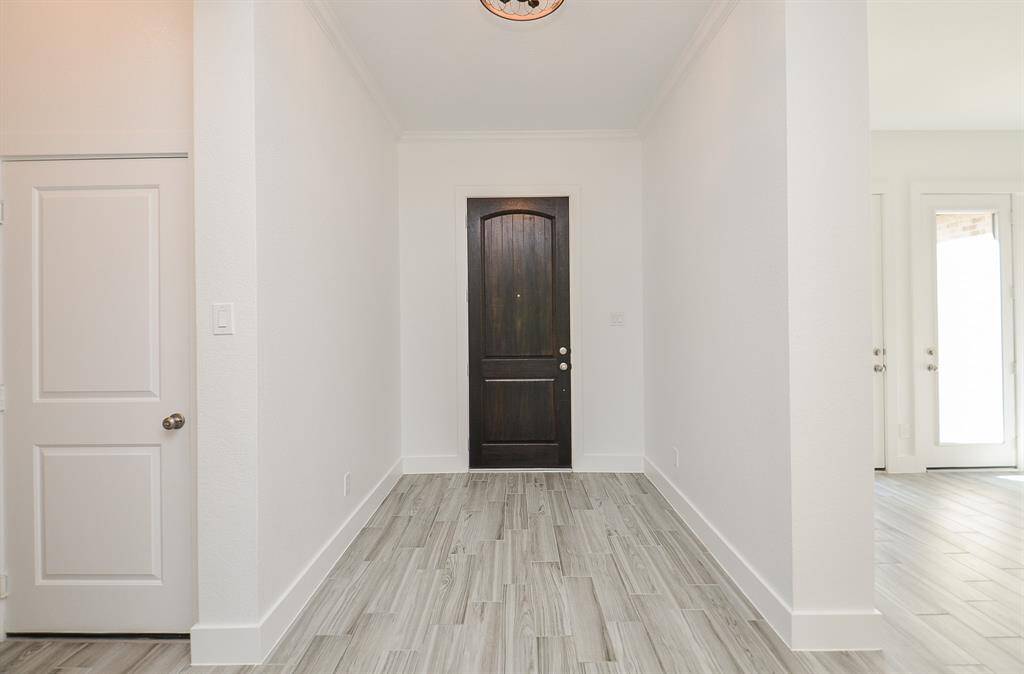 The Home Features Two Bedrooms Downstairs ~Primary and Another  Secondary Bedroom with Full Bath