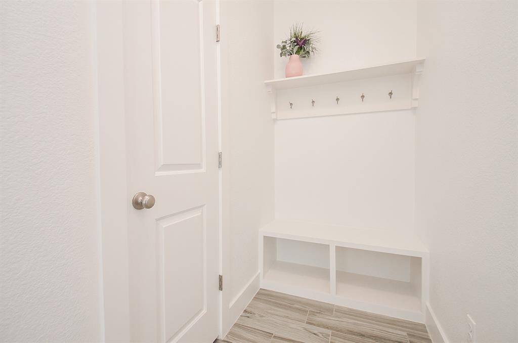 The Mud Room with Storage Space for Backpacks and Shoes ~ Large Closet Access Under Stairway for plenty of additional Storage