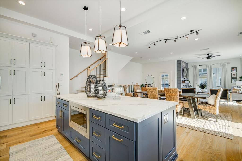 Kitchen island/cabinetry overlooking the dining room, family room, and 2nd floor patio.