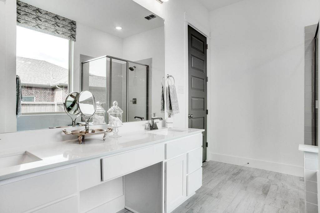 Representative photo of the Cypress plan Primary Bathroom. Shown to highlight whether it’s a quick morning routine or a leisurely evening soak, these spaces are here to enhance your everyday moments.