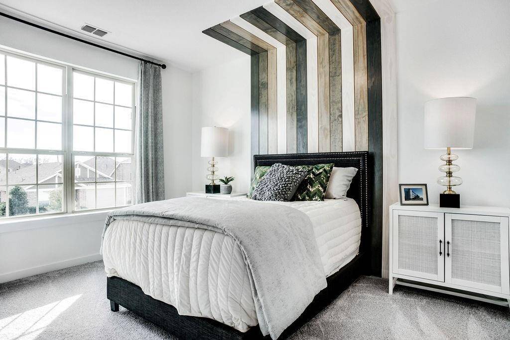 Representative photo of a Cypress plan Secondary Bedroom. Shown to highlight the comfortable layout, closet space, and natural lighting.