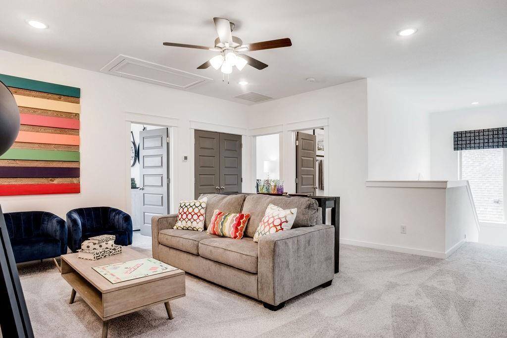 Representative photo of the Cypress plan Game Room. Shown to highlight the flexible space—ideal for entertainment, play, or relaxing with the family.