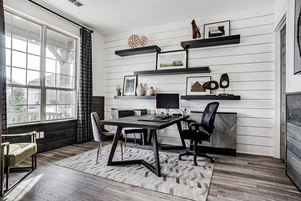 Representative photo of the Cypress plan secondary bedroom, decorated as a study. Shown to highlight the space is perfect for a home office, library, or creative studio, with plenty of room to focus and stay inspired.