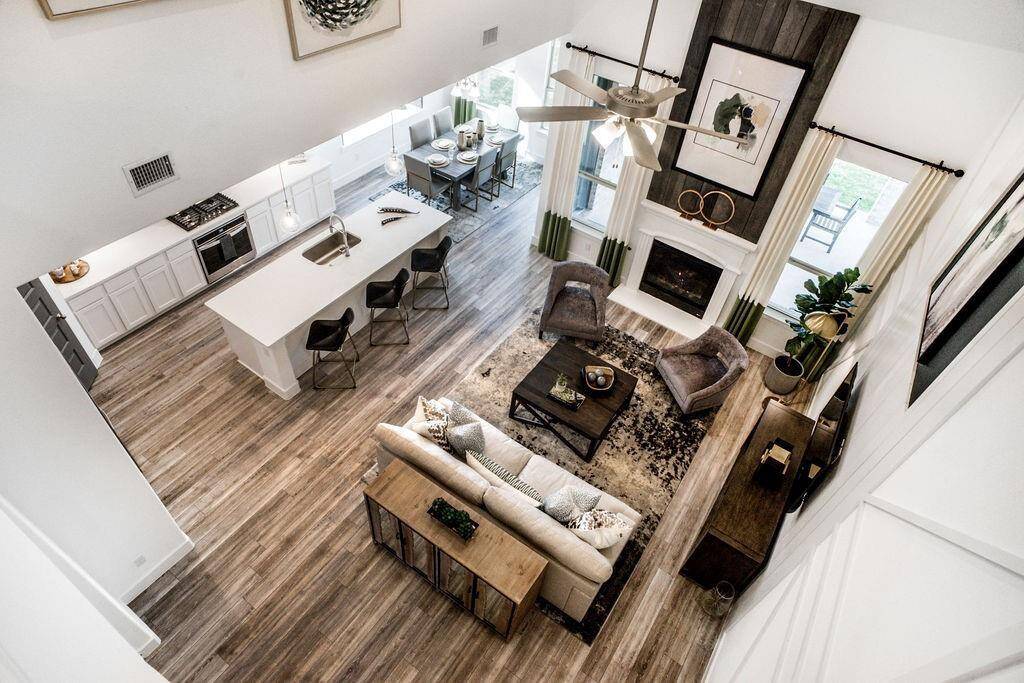 Representative photo of the Cypress plan Living Room, open to below. Shown to highlight that this home feels as expansive as it is inviting, bathed in natural light.