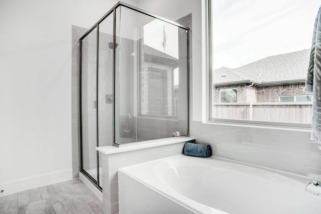 Representative photo of the Cypress plan Primary Bathroom. Shown to highlight as you glide through the spacious layout, you'll appreciate the thoughtful design elements that make getting ready a joy.