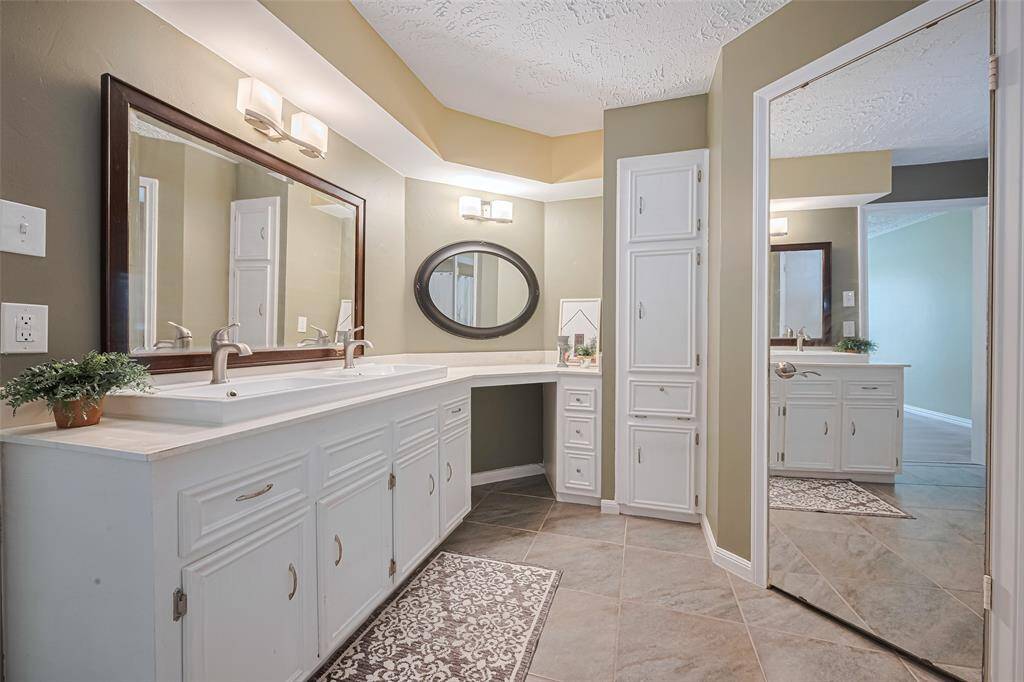 Spacious and bright primary bathroom.