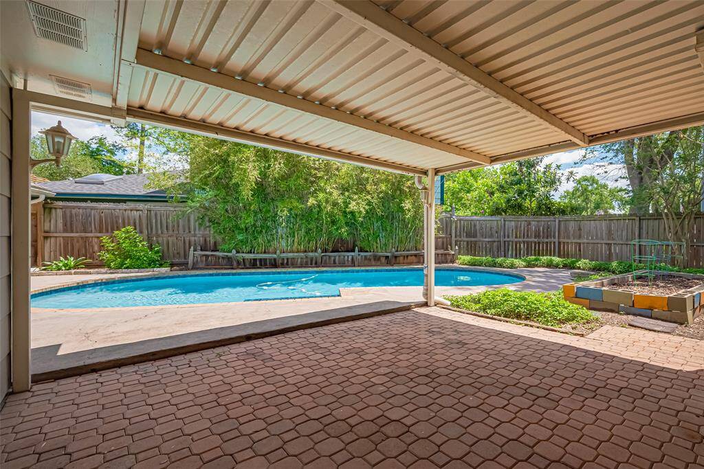 Wonderful covered patio off the back of the home.