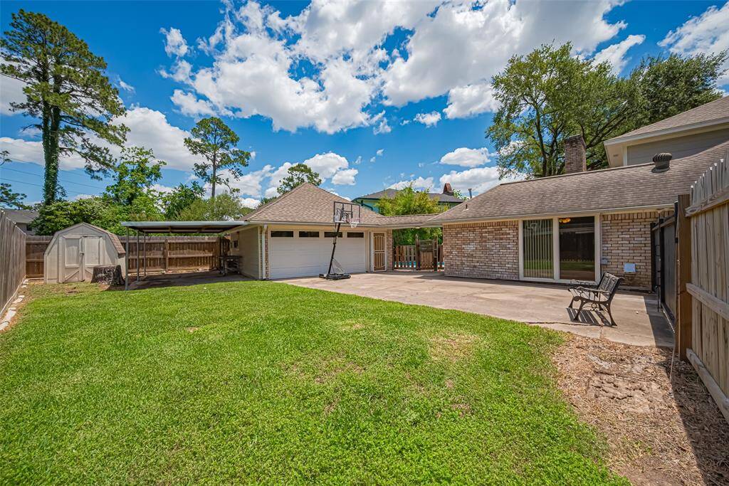 Shed, covered workshop or play area, large fenced area in the backyard.