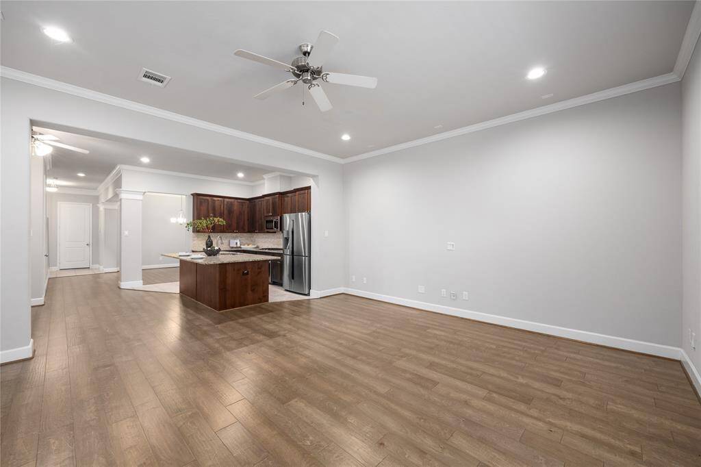 Just look at how spacious the living area is, right off the kitchen area!