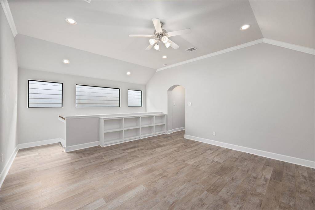 Up the stairs, you are greeted with a large game room! All carpet upstairs has been replaced with this luxury wood laminate flooring.