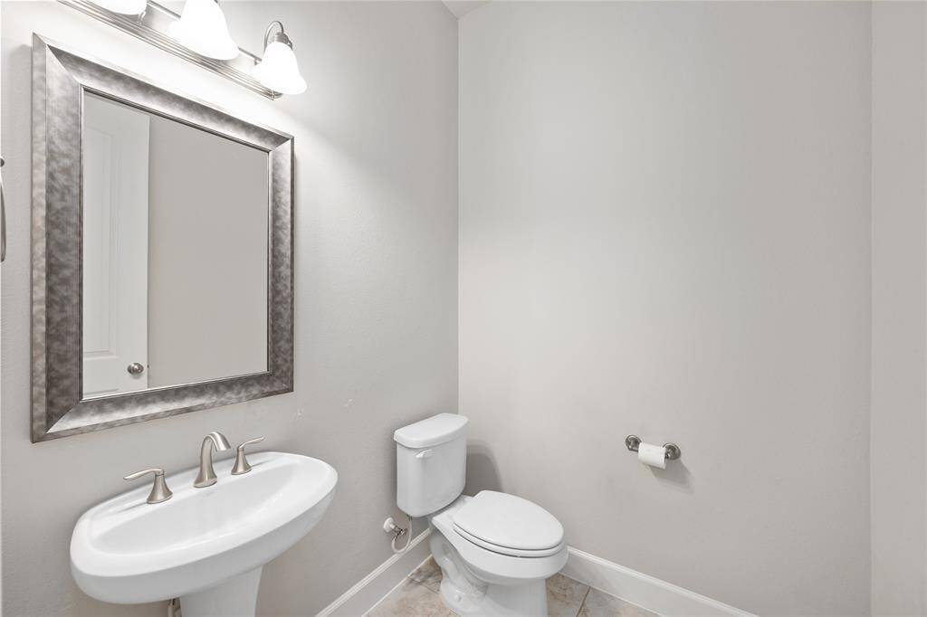 Half bathroom just off the entryway