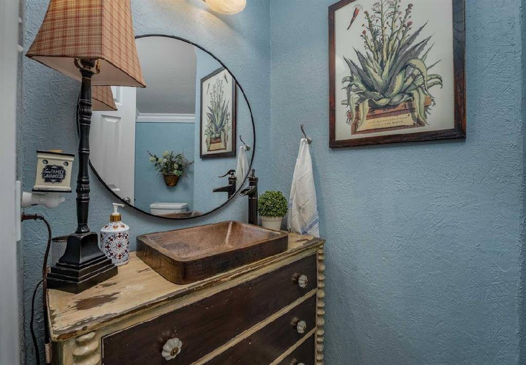 Your half bath downstairs is nestled under the stairs.