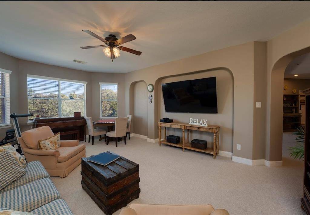 Large gameroom with a TV that will stay in the home leaves space for playing, working or entertaining.