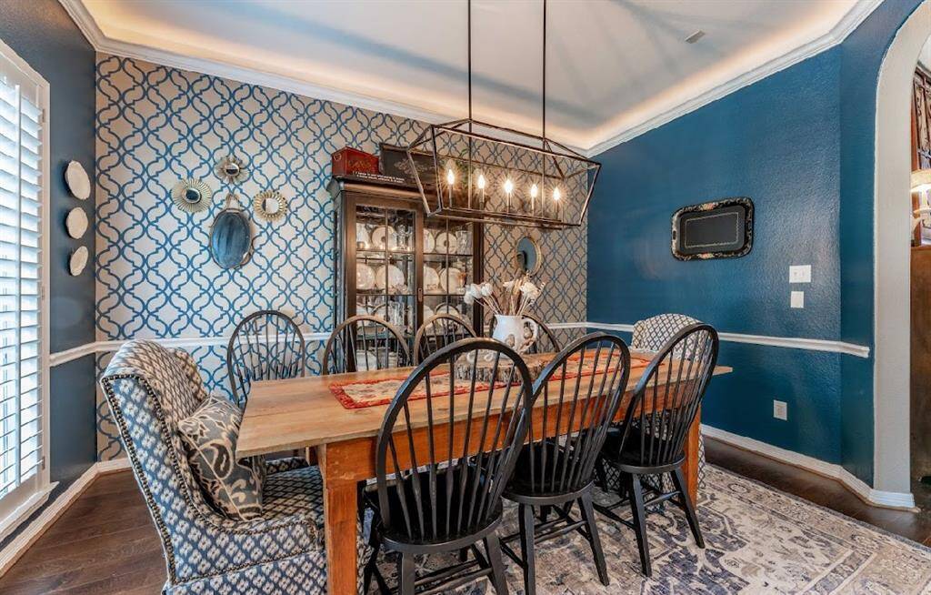 To your left of the entry is your formal dining room with upgraded lighting.