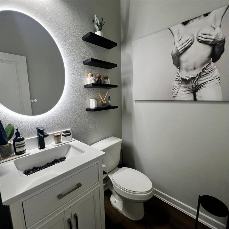 1st floor half bath with floating shelves