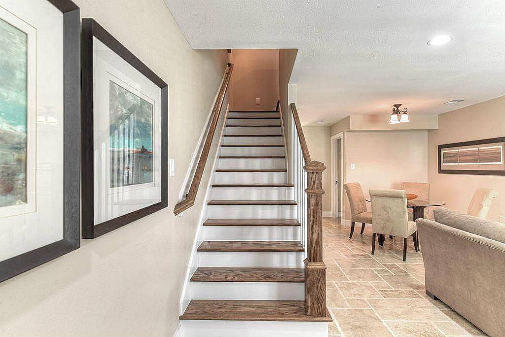 No detail was spared in this unit. The stairs and upstairs landing are all solid red oak floors.