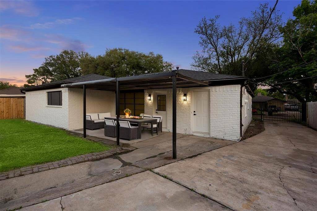 Versatile covered back porch perfect for outdoor lounging, shaded grilling, or weekend gatherings