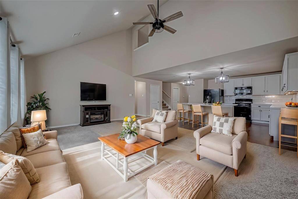 "The virtually staged open-concept living room and kitchen blend effortlessly, creating a spacious, inviting area ideal for both relaxing and entertaining. This thoughtfully designed layout highlights the natural flow between the spaces, offering modern functionality and comfort for everyday living.