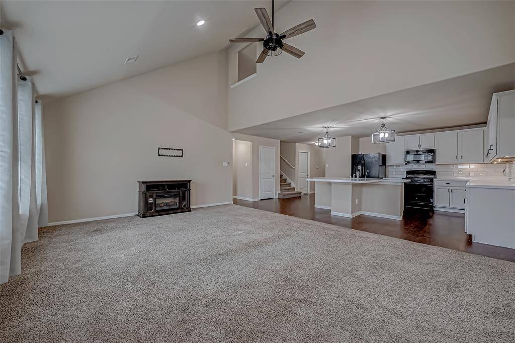 The great room provides generous space for both casual dining and a cozy living area, making it perfect for daily living and family gatherings. Its open layout fosters a warm, versatile environment—ideal for entertaining guests or simply unwinding at home.