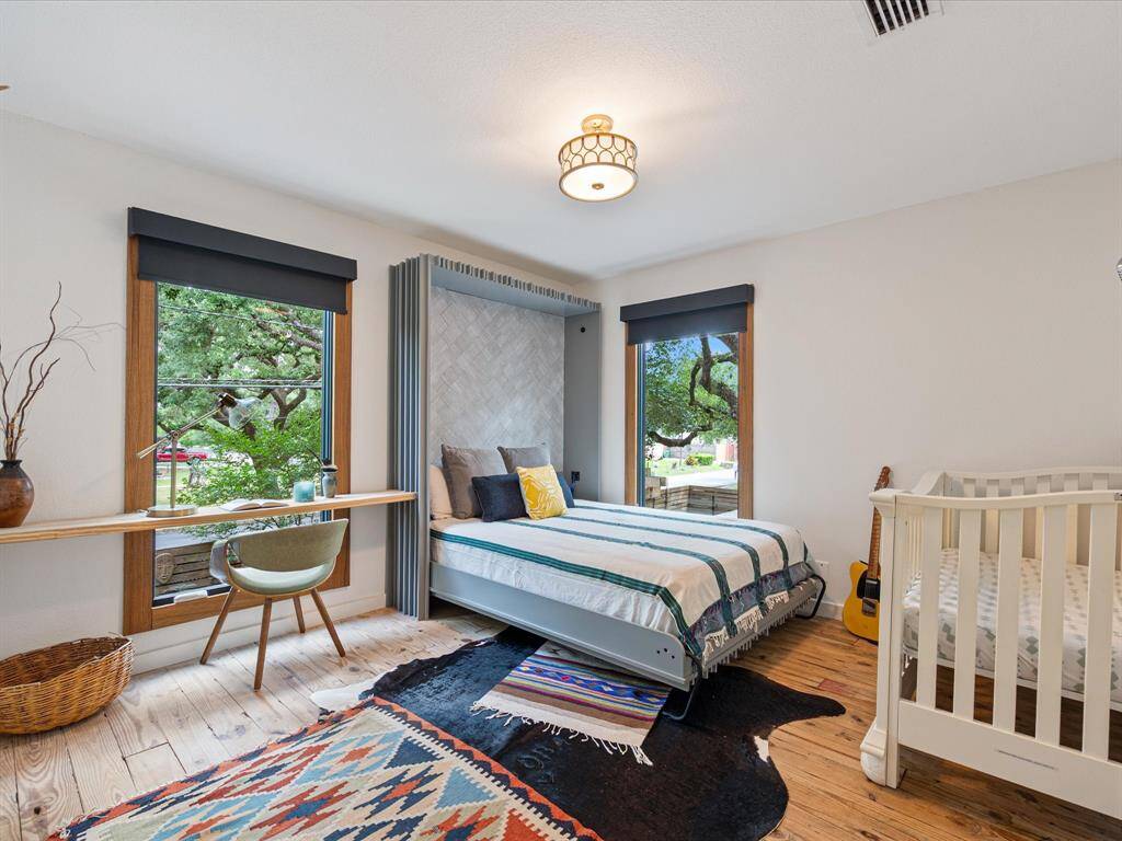 Guest room can function as a proper bedroom or an office space for occasional company with this custom murphy bed.