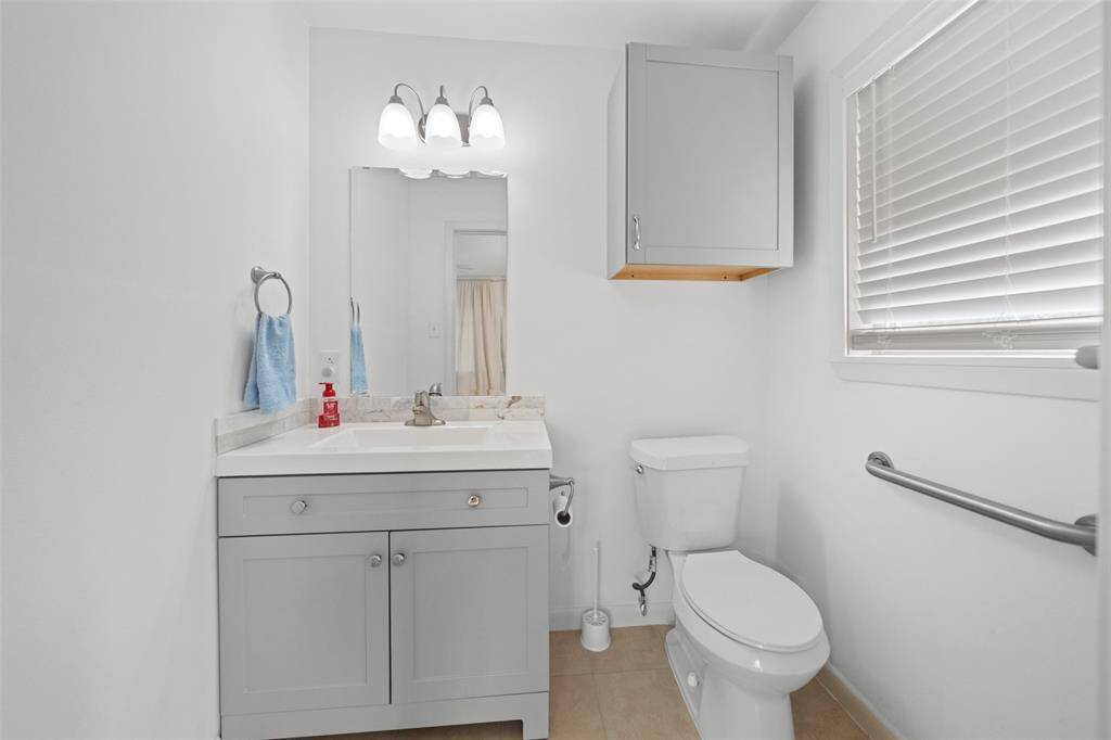 View of the half bath in the front bedroom.