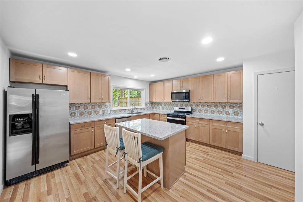 The kitchen island doubles as a breakfast bar.