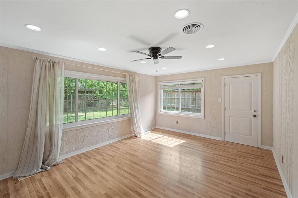 Large family room that could be a kid's playroom, home office or could be remodeled into a great primary suite.