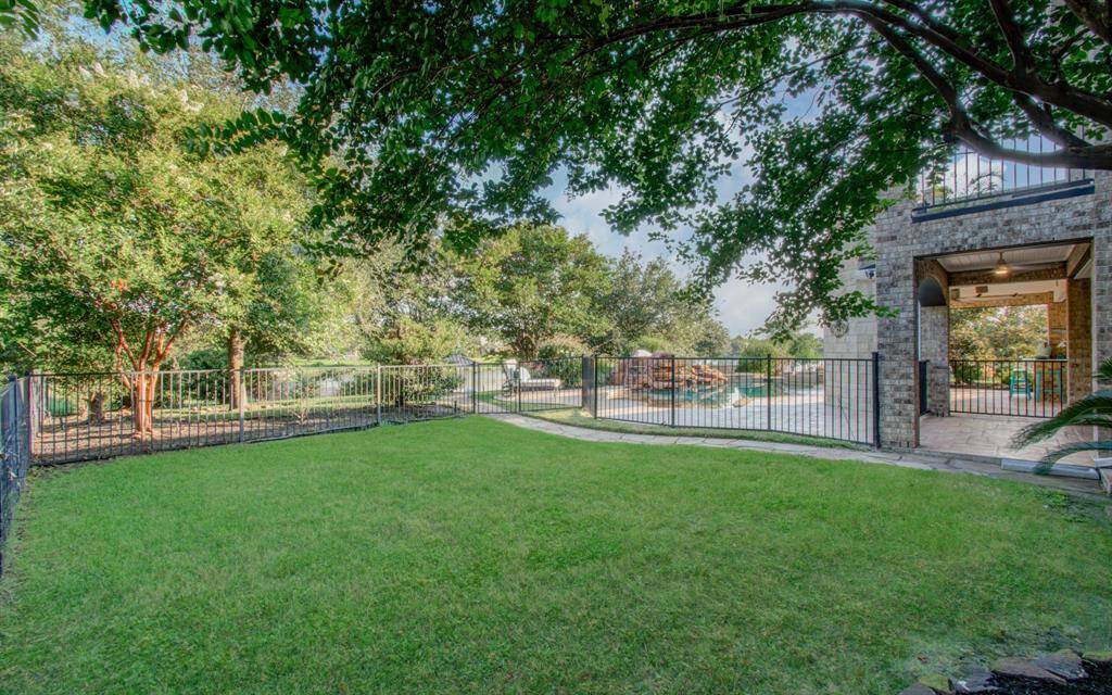 Spacious gated side yard  perfect for pets or little ones to wonder without worry.