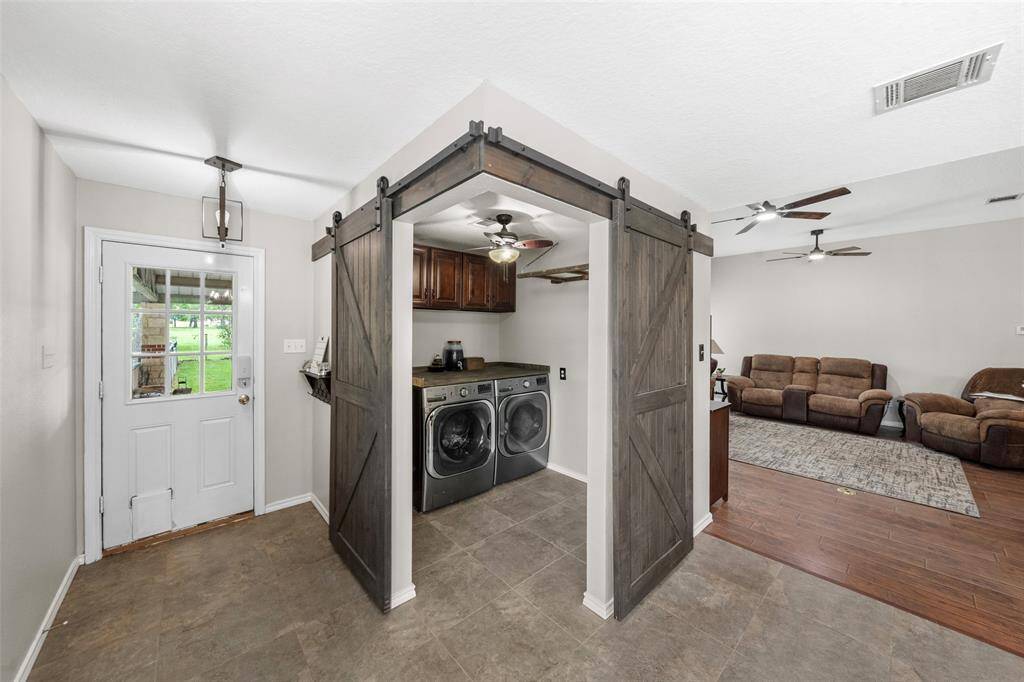 Laundry room conveniently tucked away but easily accessible