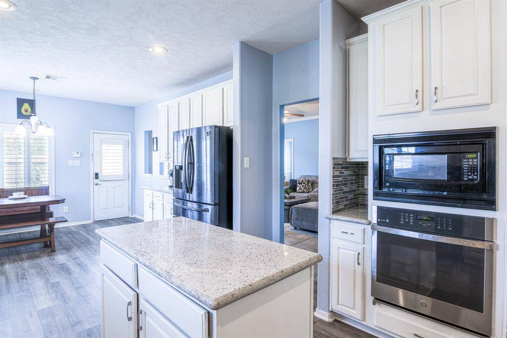 Updated appliances and lighting make this kitchen a pleasure to create meals in.