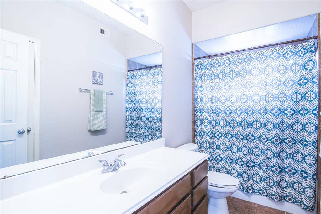 Bathroom 2 has two entrances, one from bedroom 2 and the other to the hallway near the stairs.