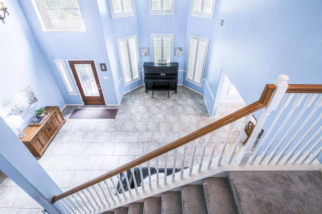 The architectural details in this house are striking from every vantage point. Notice the large brick-pattern tiles and elegant angles.