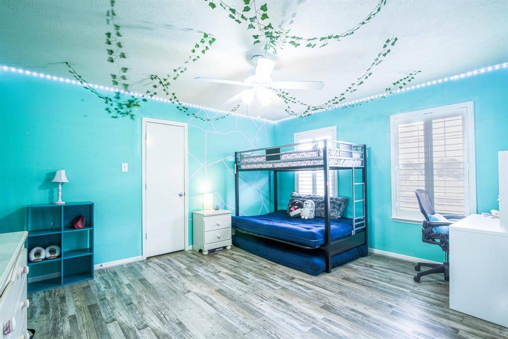 Bedrooms 3 and 4 each also have modern LVP flooring.
