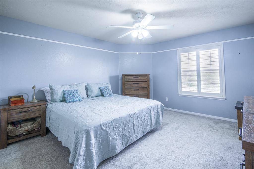 Bedroom 5 is part of the independent  upstairs and has a large closet and a ceiling fan.