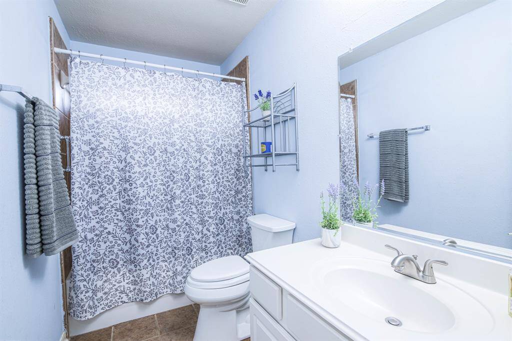 Bathroom 4 is located in the independent upstairs suite.