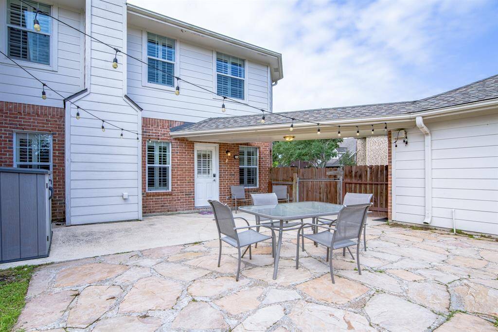 Outside, the flagstone patio is spacious and creates the perfect place for grilling or gardening.