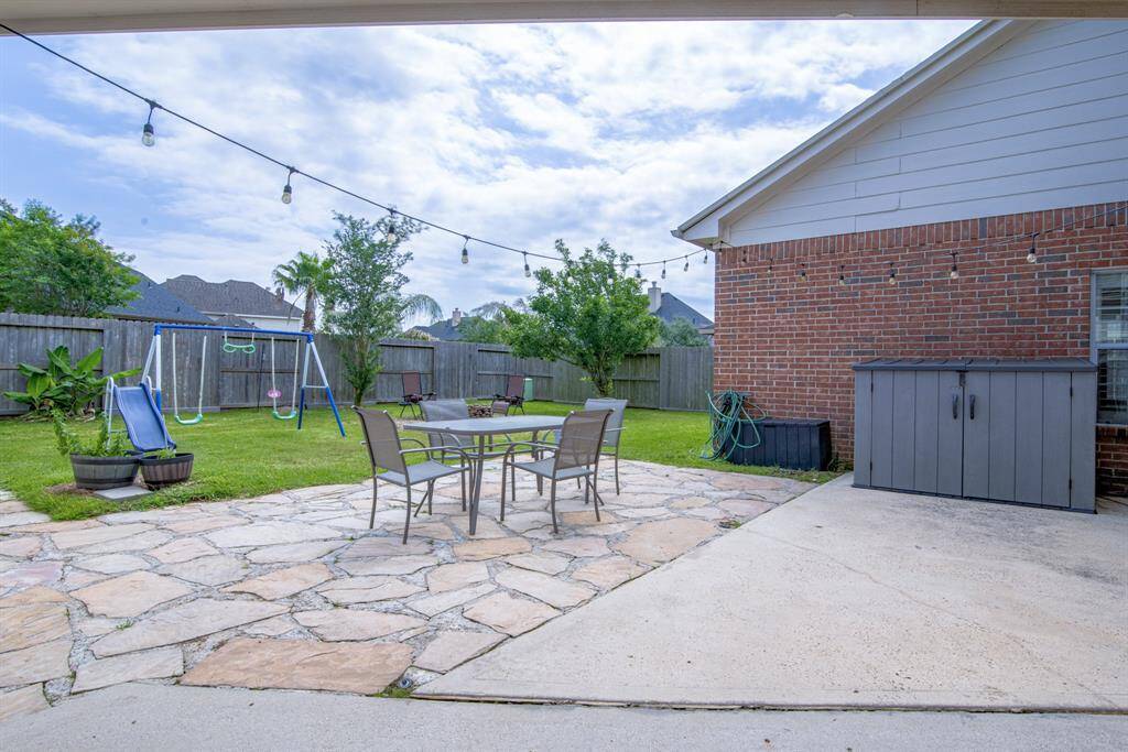 Beyond the patio, the spacious backyard is a great space to play and enjoy the great outdoors.