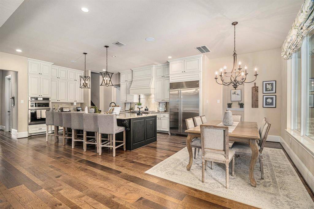 The open-concept kitchen and breakfast area is designed for convenience and style.