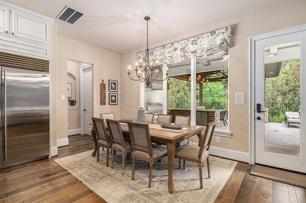 Start your day in the charming breakfast room adjacent to the luxurious gourmet kitchen. This cozy space is filled with natural light, providing a perfect spot for casual dining and morning coffee.
