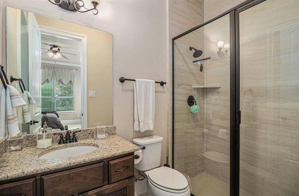 The guest bathroom on the first floor is elegantly designed perfectly complementing the cozy guest room it accompanies.
