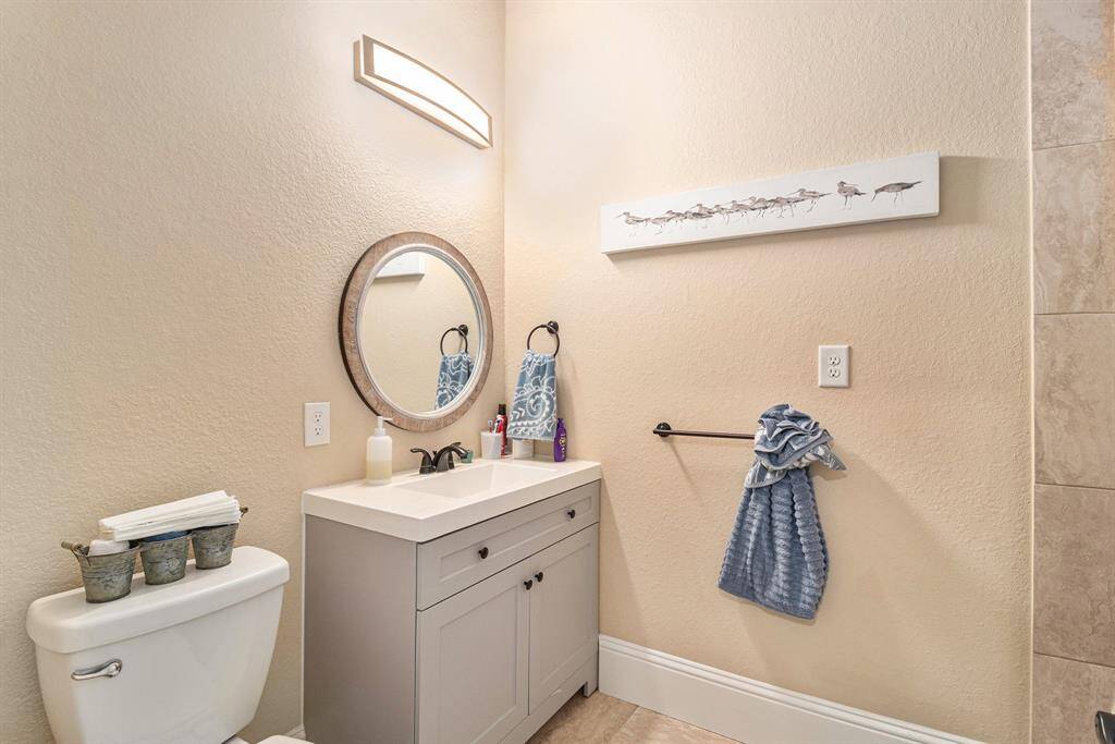 Complete full bathroom that complements the recently added versatile room.