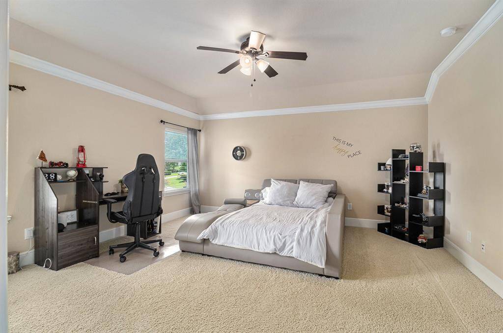 This bedroom offers ample space and an abundance of natural light. This inviting room provides a bright and airy atmosphere, perfect for creating a comfortable and relaxing retreat.