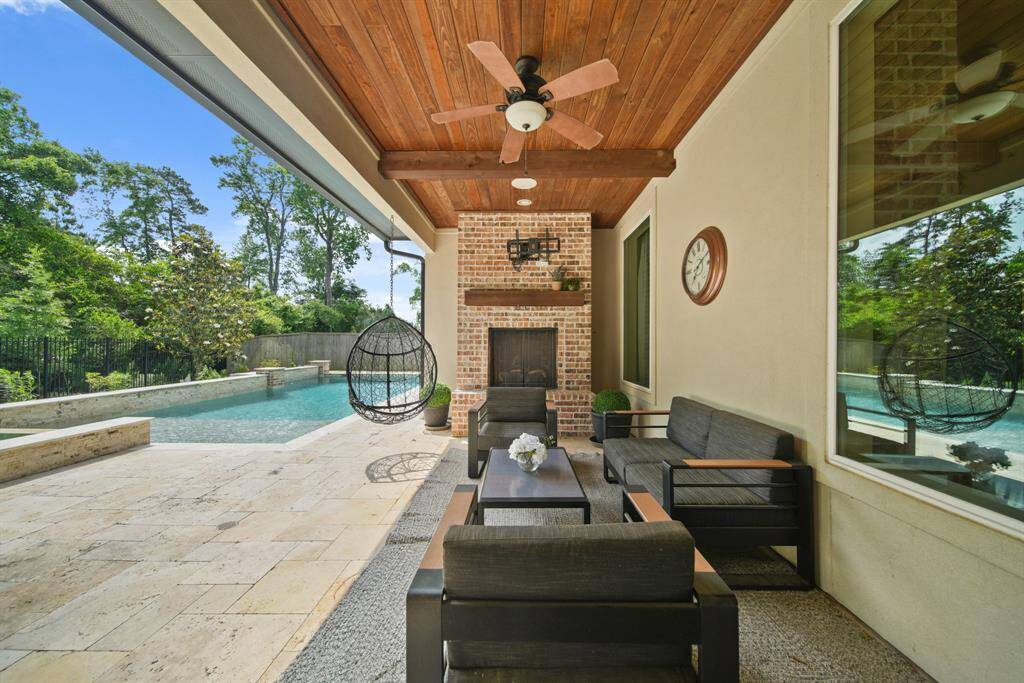 The covered patio provides a comfortable dining area and lounge, ideal for entertaining guests.