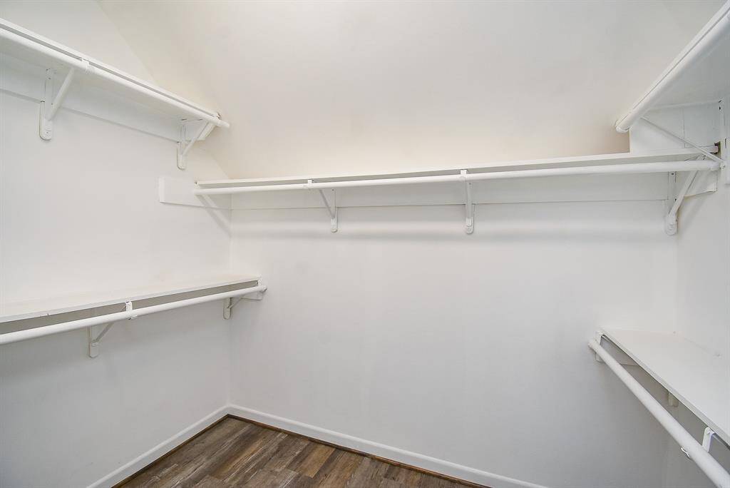 Keep your belongings secure and organized in this large walk-in closet.