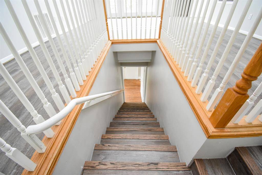 Stairs upgraded with newly installed vinyl planks.