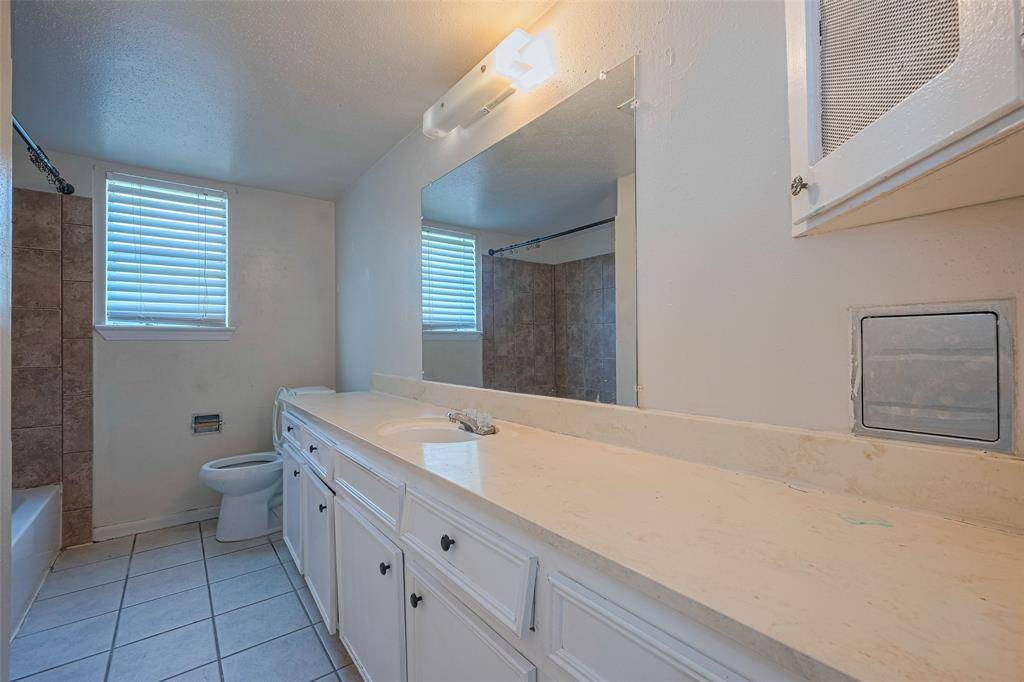 Second bathroom with tub/shower combo.