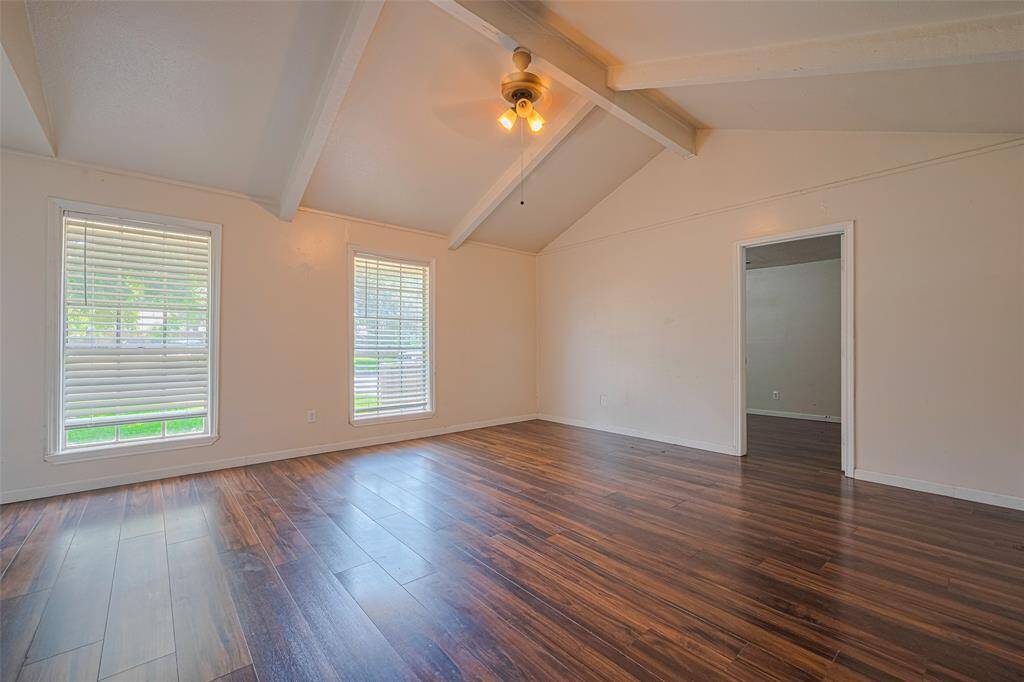 Living room and the door goes to the 4th bedroom which used to be part of the garage.