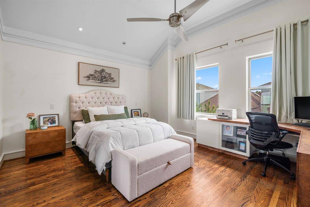 Primary bedroom with a custom desk that stays. Located on 3rd floor.
